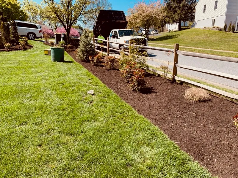 A fresh mulch and planting bed installed in New Castle County